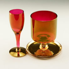 Have a smoke and a little spirit in elegant style! Beautiful ruby blown glass goblet and cigarette or paraphernalia holder. Rich golden ruby color achieved using real gold from yesteryear.