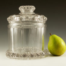 This antique retail counter jar is marked "Imperial Cube" on top of the lid. Beautiful pattern of cannon balls and pillars. Made by the Imperial Glass Company, est. circa 1930 or earlier.