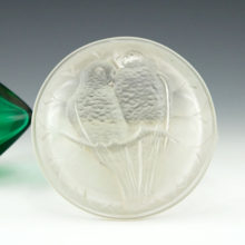 Antique satin glass puff box featuring a pair of lovebirds sitting on a branch. Made in the 1920's by a company within the U.S. Glass Consortium.