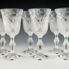 A set of 6 heavy pressed crystal wine goblets. These goblets are of a nice quality crystal with heavy decor.