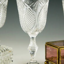 The stepped, 6-sided decor on the stem is very attractive. This is a beautiful quality set. The almost white, thick crystal has a long, lingering tone when pinked.