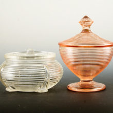 Set of two Depression glass vanity jars, circa 1930-1940. Classic Depression glass vanity jars. Both in excellent condition.