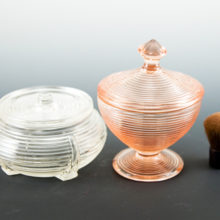 The pink compote's lid finial is slanted just a bit, look closely at images (happens during old fashioned cooling methods). This is not unexpected in Depression glass. It was a premium giveaway, perhaps found in a box of laundry detergent or oatmeal.