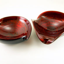 1950's Murano glass bowls in dark ruby glass with aventurine in a swirling vortex. Looks like ruby star dust.