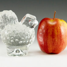 Crystal table charm by Pukeberg Glasbruk measures 3½" tall, 3½" long and 2" wide. Weighs 1 lb. In like-new condition