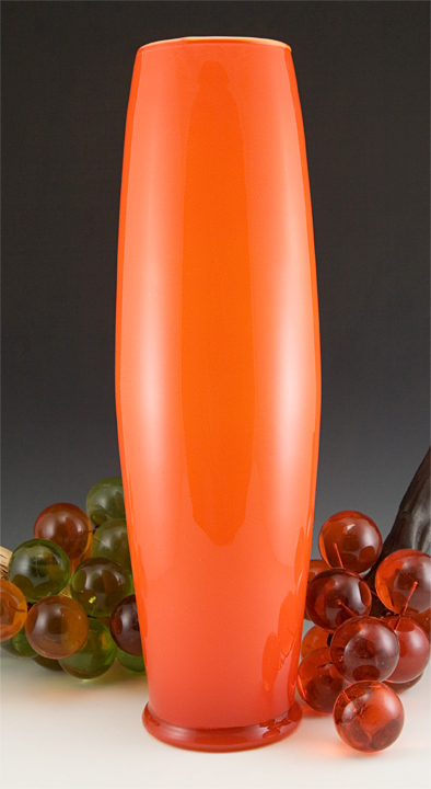 Large vintage retro mod orange-orange vase cased in white and colorless glass.