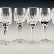 Set of six rock crystal stemware goblets with drawn stems and cut decor. Hand blown and hand cut.