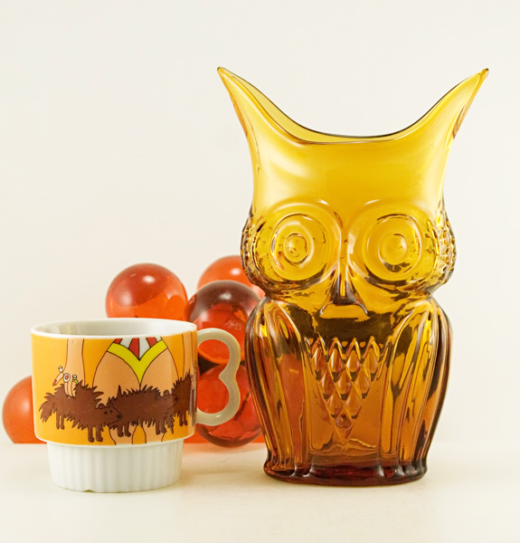Heavy glass, blown from mold, then hand-tooled to produce "ears".