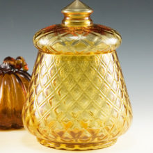 Beautiful Fenton Art Glass canister with lid made between 1962 and 1964. The original part no. is 1780 and the pattern was called 'Candies'.