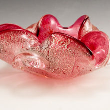 Vintage Murano Venetian art glass cigar bowl cased in cranberry and colorless crystal with layers silver foil veil sandwiched between.