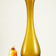 Mid-20th Century Swedish modern cased glass vase commands attention. This large hand blown glass trumpet vase weighs 4.75 lbs and stands 16" tall. Sitting next to a life-size glass pear in main image to demonstrate how big the vase is.