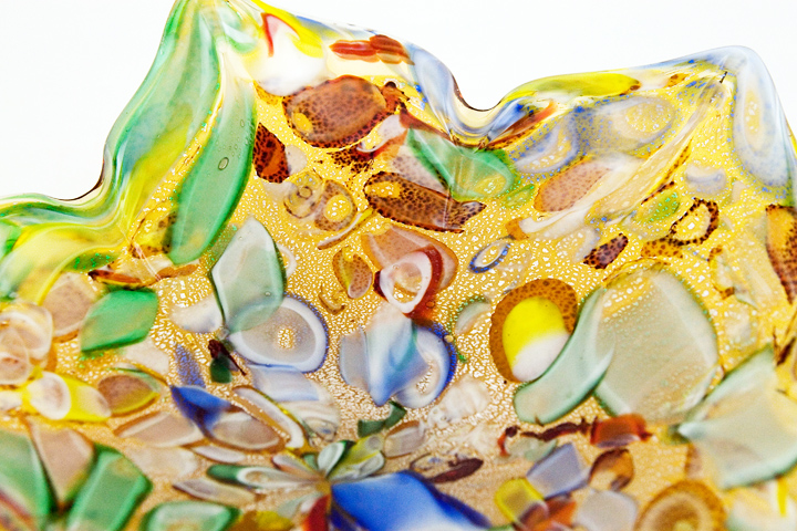 Hundreds of colorful murrina encased in yellow glass and speckled with silver aventurine.