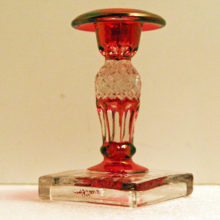 Beautiful pink cranberry stained signed & dated candlestick holder.
