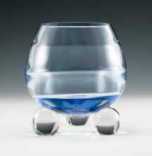 Tiffin Copen Blue Swedish Modern rose bowl with horizontal optics and three ball feet. Circa late 1940s to early 1950's. Thick handmade crystal.