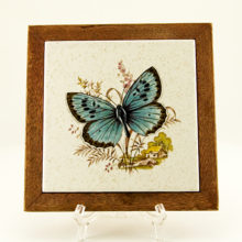 Blue butterfly trivet measures 7½" square. Can be used as a trivet or wall decor.