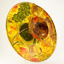 Mid-Century era huge divided party server tray in sturdy, long-lasting pressed fiberware laminating a colorful fruit textile.