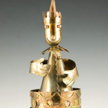 Patinated cut metal figurine vintage music box made in the 1970's and 1980's.