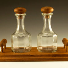 Well-preserved Mid-Century Modern teak wood condiment set made of genuine teak and Italian glass.