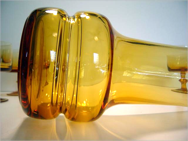 The pitcher of this blown glass cocktail set looks Italian, or Kaj Franck style.