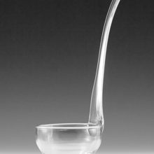 Antique blown glass ladle with a convenient flat bottom that allows it to stand alone.