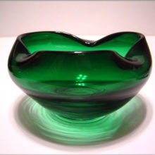 A lovely hand blown deep green glass rose bowl.