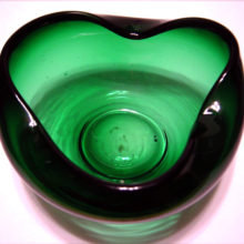 The green glass rose bowl is hand-blown with soft pontil mark.