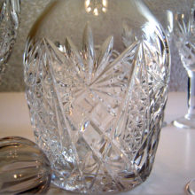 The Depression crystal decanter and wine glass set were hand blown and tooled.