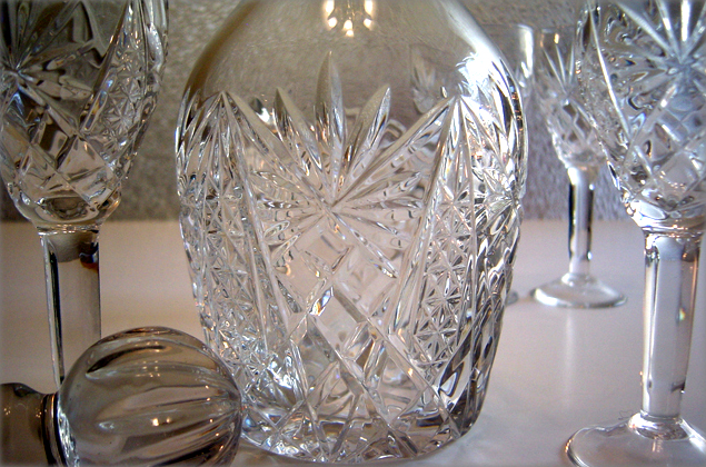The Depression crystal decanter and wine glass set were hand blown and tooled.