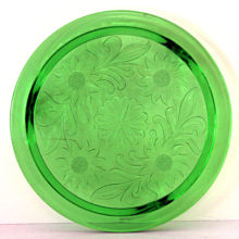 Beautiful Depression vaseline glass cake plate made by Jeannette Glass Company in the 1930's.