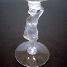 The frosted, molded figural stem is applied to this draped lady wine stem.