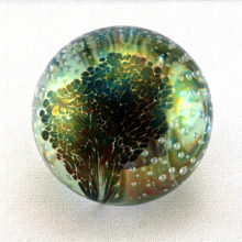 Beautiful GES paperweight with trapped bubbles and dichoric fauna.
