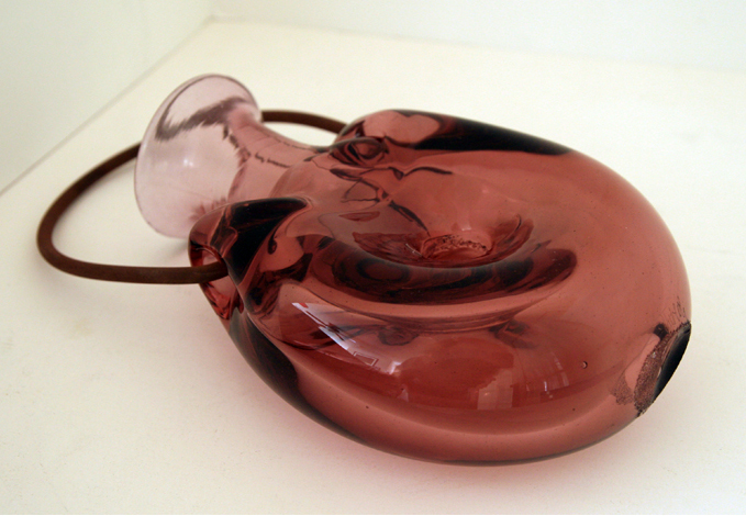 Forato hand blown flask with concave pontil mark.