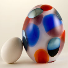 A beautiful and unusual 2 pound jeweled Kiwi glass egg.