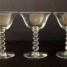 The Candlewick wine stems are part of the Candlewick line that was designed and patented by the Imperial Glass Co. in 1936.