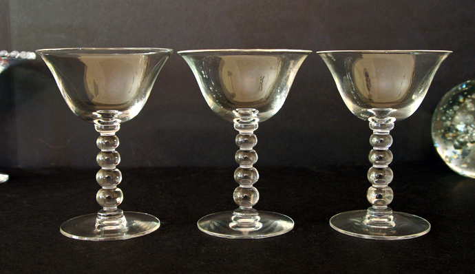 The Candlewick wine stems are part of the Candlewick line that was designed and patented by the Imperial Glass Co. in 1936.