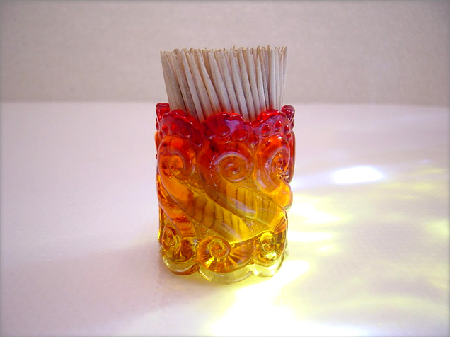 A beautiful little piece, this Amberina glass toothpick holder is made by Kanawha Art Glass.