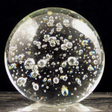 Intentional bubble inclusion art glass paperweight.