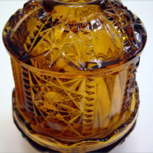 Amber molded glass - pattern name: "Stars & Bars".