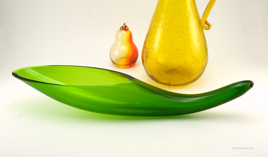 A mid-century modernist's vision of the horn of plenty. It was blown by mouth and finished by hand. Thick, luscious vintage glass. Stylized elliptical opening is polished flat.