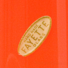The label on the retro modern vase reads: Handmade Fayette Glass. We believe 'Fayette' may have been the name of this vase's decor line. The exact form has also been documented with a 'Smith Glass' label.