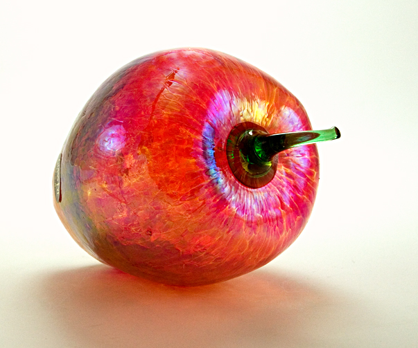 Hand-made with a glass recipe that includes ash from Mount St. Helens eruption. Blown into mold and hand-finished with applied stem. Hollow inside, but made with heavy, thick glass walls.