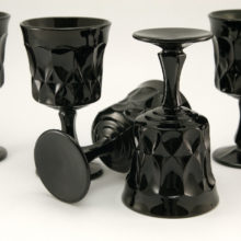 These black glass goblets are made of thick, opaque solid black glass. Hard to find today, especially in black, and in quantities.