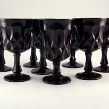 Perspective pattern heavy black glass goblets made in Japan. Production began in 1969 and ended in 1985. Noritake still exports glassware, but it is modern colorless glass.