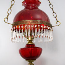 This Victorian style hanging lamp was made in the late 1970's by Fenton Art Glass, USA. It is a reproduction of authentic Victorian lamps, and made with modern materials.