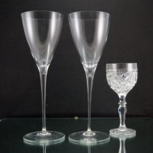 Vintage Tiffany crystal goblets command attention at 10.5" tall. Shown in image one with a normal size wine glass for comparison. Produces a fine lingering ting when plinked. Perfect for the wedding toast.