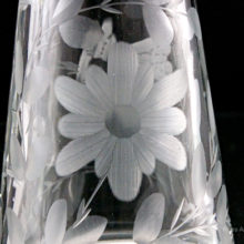The pattern was deep etched by hand. Features flora, fauna and a butterfly. Unusual pattern not found in Cambridge Glass reference books.