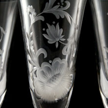 The hand-etched florals appear whitish against the gray background. Looks very classy.