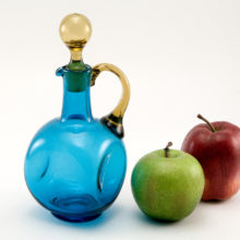 Large hand-blown vintage glass cruet in canary yellow and blue.