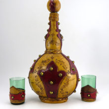 Set of mid-century Italian leather clad barware including a very large decanter and two double shot glasses.