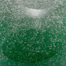 (Italian, from the dialect word pulega, “bubble”) Glass containing numerous bubbles of all sizes, produced by adding bicarbonate of soda, gasoline, or other substances to the melt.